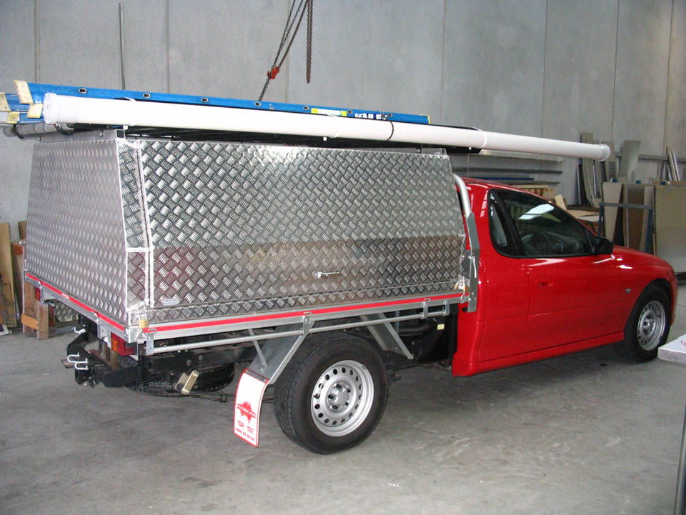 <span  class="uc_style_uc_tiles_grid_image_elementor_uc_items_attribute_title" style="color:#EFF7F9;">Two door lift off canopy on Commodore Ute - No.49</span>