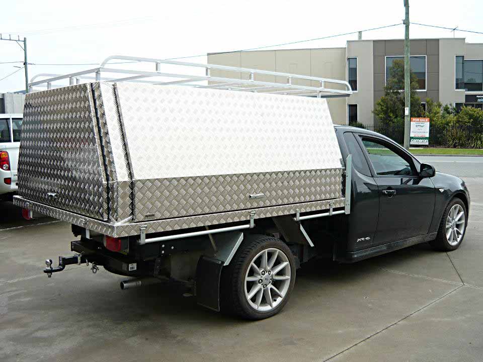<span  class="uc_style_uc_tiles_grid_image_elementor_uc_items_attribute_title" style="color:#EFF7F9;">Three door fixed canopy with roof rack fitted to Falcon ute</span>