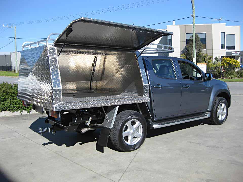 <span  class="uc_style_uc_tiles_grid_image_elementor_uc_items_attribute_title" style="color:#EFF7F9;">Two door canopy on Isuzu D-Max with roof rack</span>