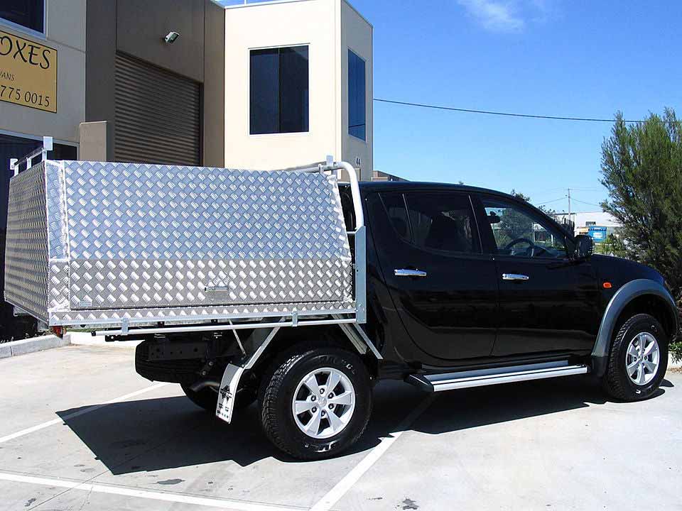<span  class="uc_style_uc_tiles_grid_image_elementor_uc_items_attribute_title" style="color:#ffffff;">Two door fixed canopy on Mitsubishi Triton</span>