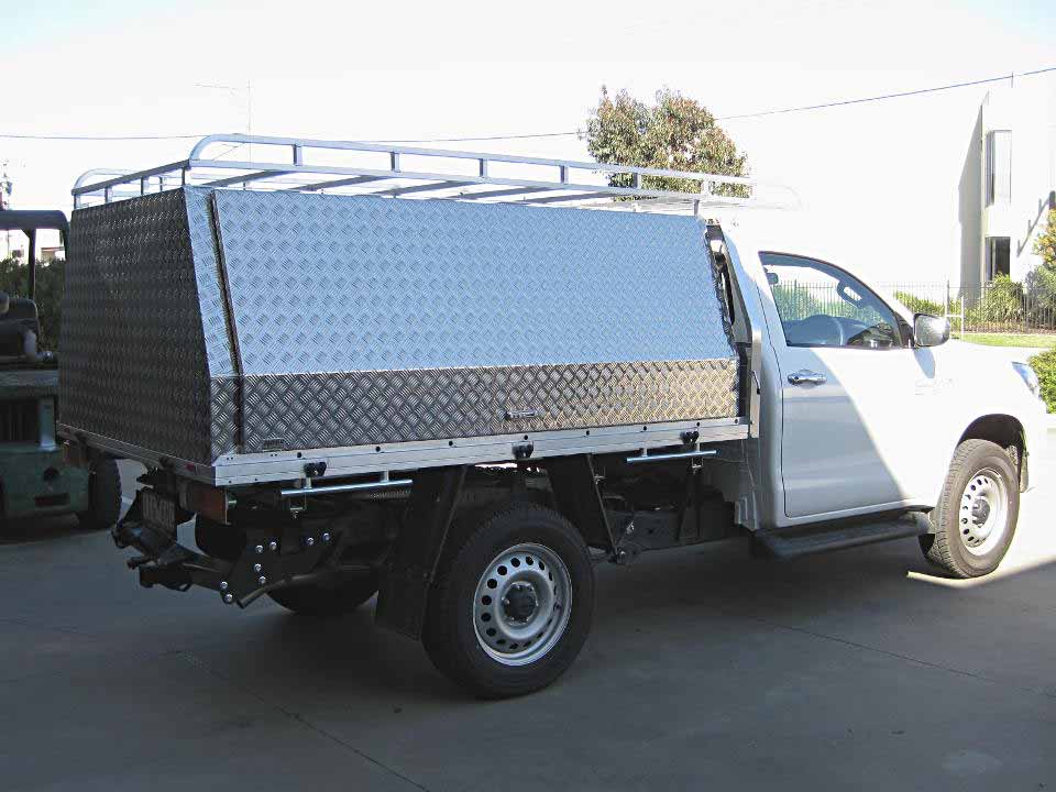 <span  class="uc_style_uc_tiles_grid_image_elementor_uc_items_attribute_title" style="color:#ffffff;">Two door canopy fitted to Toyota Hilux</span>