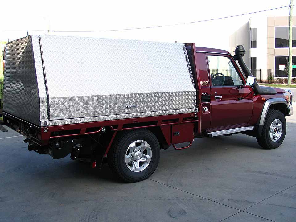 Maroon Toyota Land Cruiser with Ute Canopy