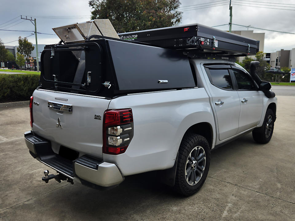 <span  class="uc_style_uc_tiles_grid_image_elementor_uc_items_attribute_title" style="color:#EFF7F9;">Custom tool box & stair case with roof top tent</span>